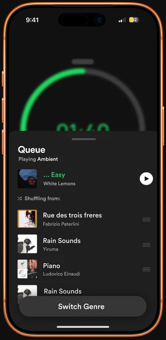 Queue sheet over the blurred timer, listing the next tracks with a Switch Genre button